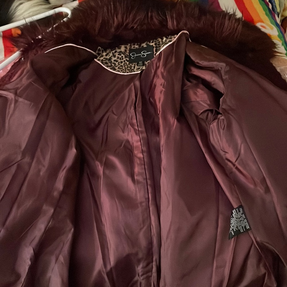 Jessica Simpson burgundy coat.